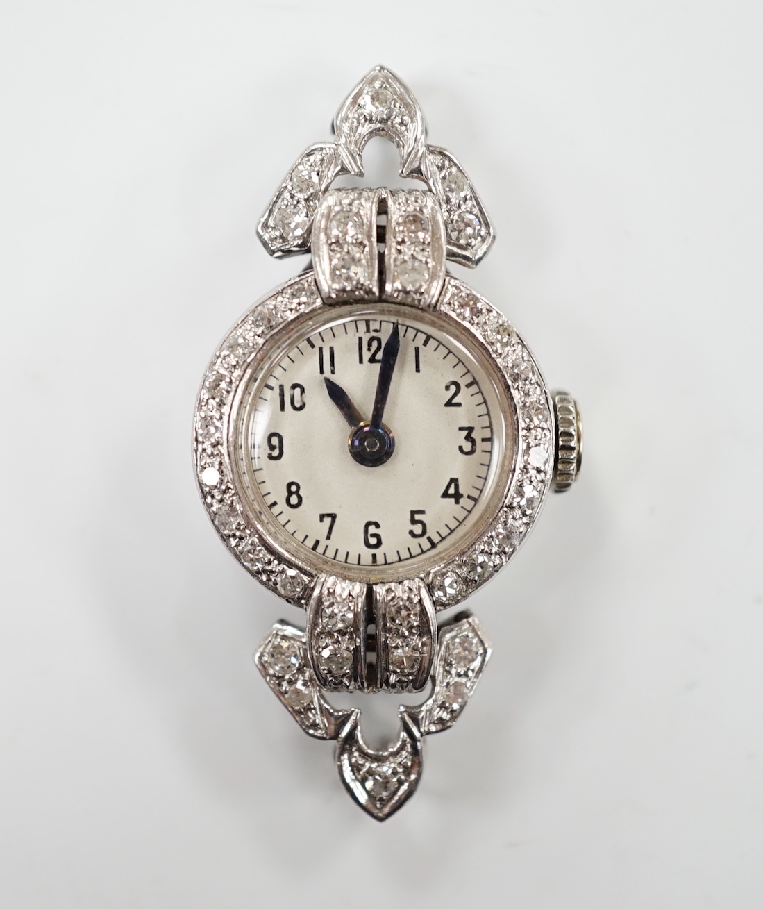 A mid 20th century white metal (inscribed platinum) and diamond cluster set Albion manual wind cocktail watch, no strap, gross weight 10 grams.